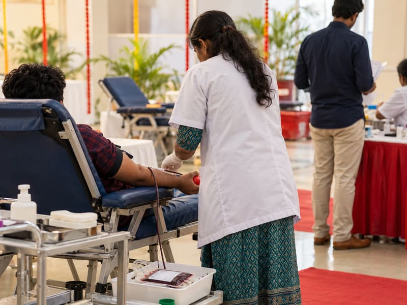 A community blood donation drive with donors and medical staff